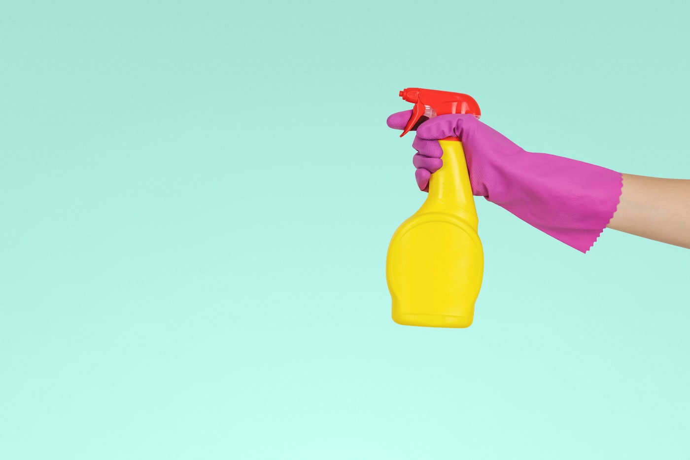 A graphic detail from the site: spray bottle and glove.