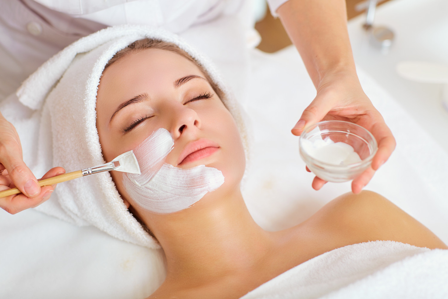 A facial mask applied with a brush.